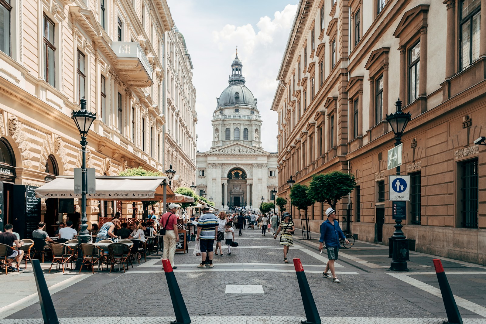 people walking on street near brown concrete building during daytime