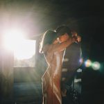 woman in white dress standing on stage